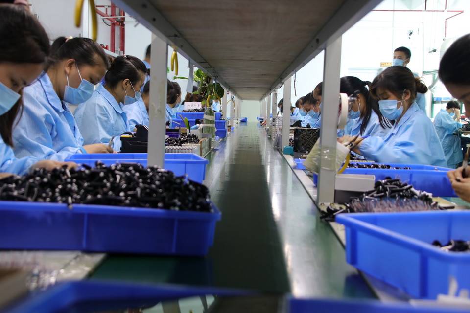 workers on assembly line 3.jpg